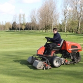 Greenkeeper on grasscutter